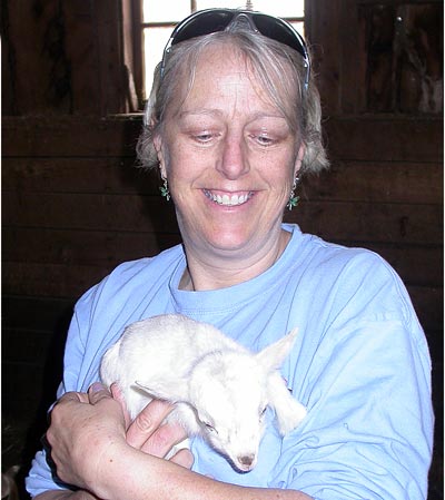 Kristen with newborn miniature Nigerian goat